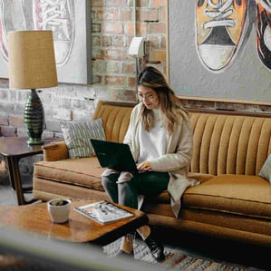 A woman working with a laptop